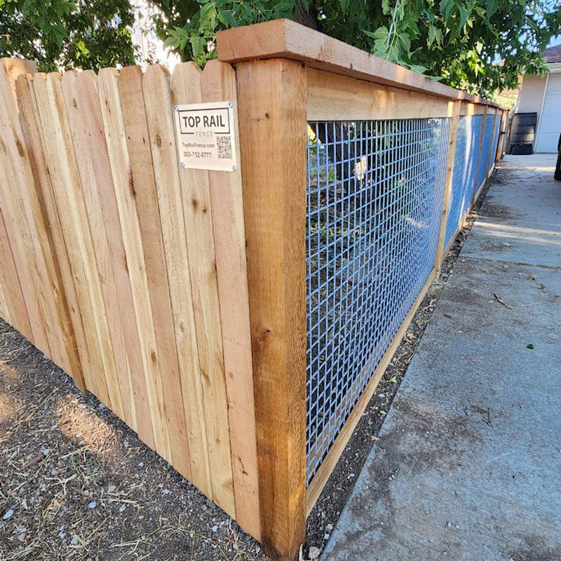 stockade with chicken wire fence
