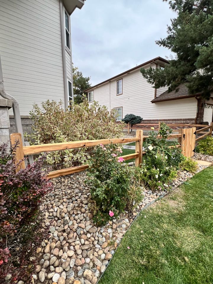 This is a 3 1/2 foot high two rail split rail fence with welded wire and one single swing gate. The fence and gate are constructed to meet the HOA regulations in a golf course community in Thornton, Colorado.