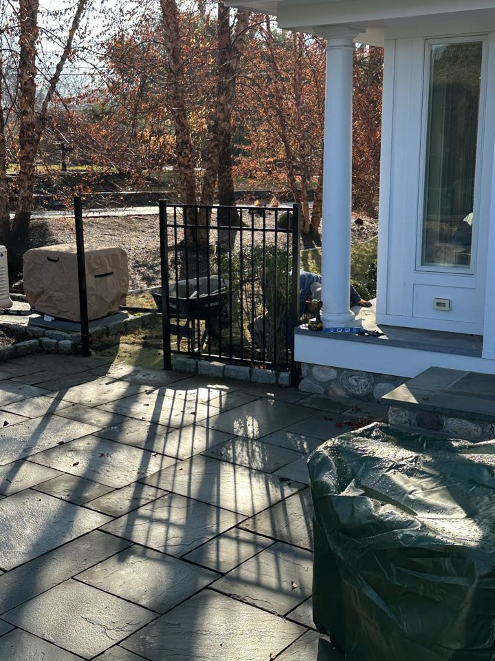 Crew hard at work despite the cold! A new 3-rail aluminum fence going in around the pool, with a vinyl privacy fence for the pool equipment. 