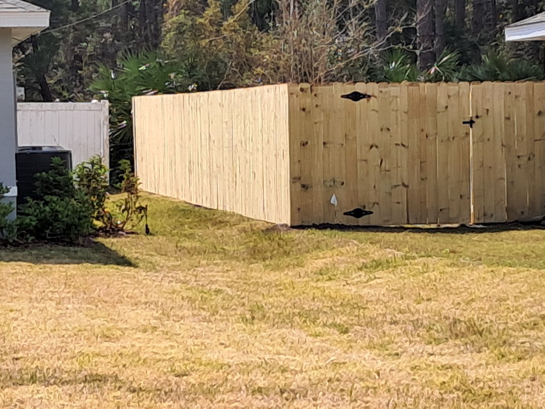 Installed a 6ft Stockade fence in Palm Coast to give the dogs some  room to play.