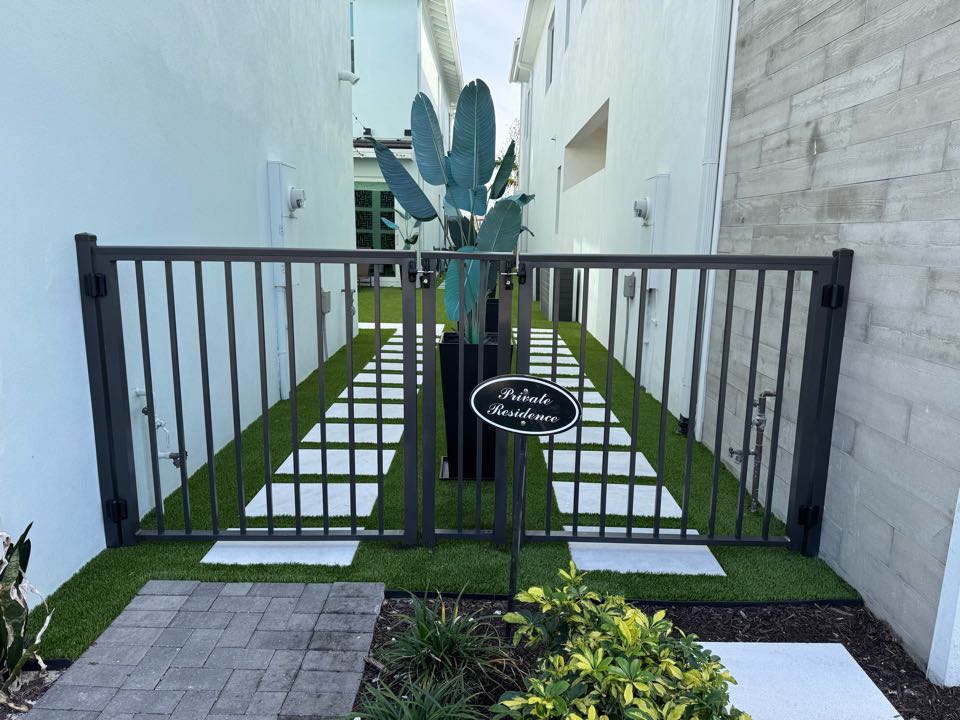 Excited to complete a unique fencing project in the Alton neighborhood of Palm Beach Gardens! We installed four 4ft tall bronze aluminum gates—two at the front and two at the rear—for two neighbors sharing a side yard. This stylish, durable solution enhances access and aesthetics while maintaining a cohesive look. Looking for a fence company in Palm Beach Gardens? Get in touch today!