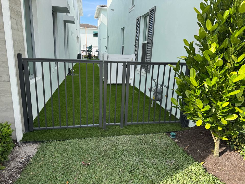 Excited to complete a unique fencing project in the Alton neighborhood of Palm Beach Gardens! We installed four 4ft tall bronze aluminum gates—two at the front and two at the rear—for two neighbors sharing a side yard. This stylish, durable solution enhances access and aesthetics while maintaining a cohesive look. Looking for a fence company in Palm Beach Gardens? Get in touch today!