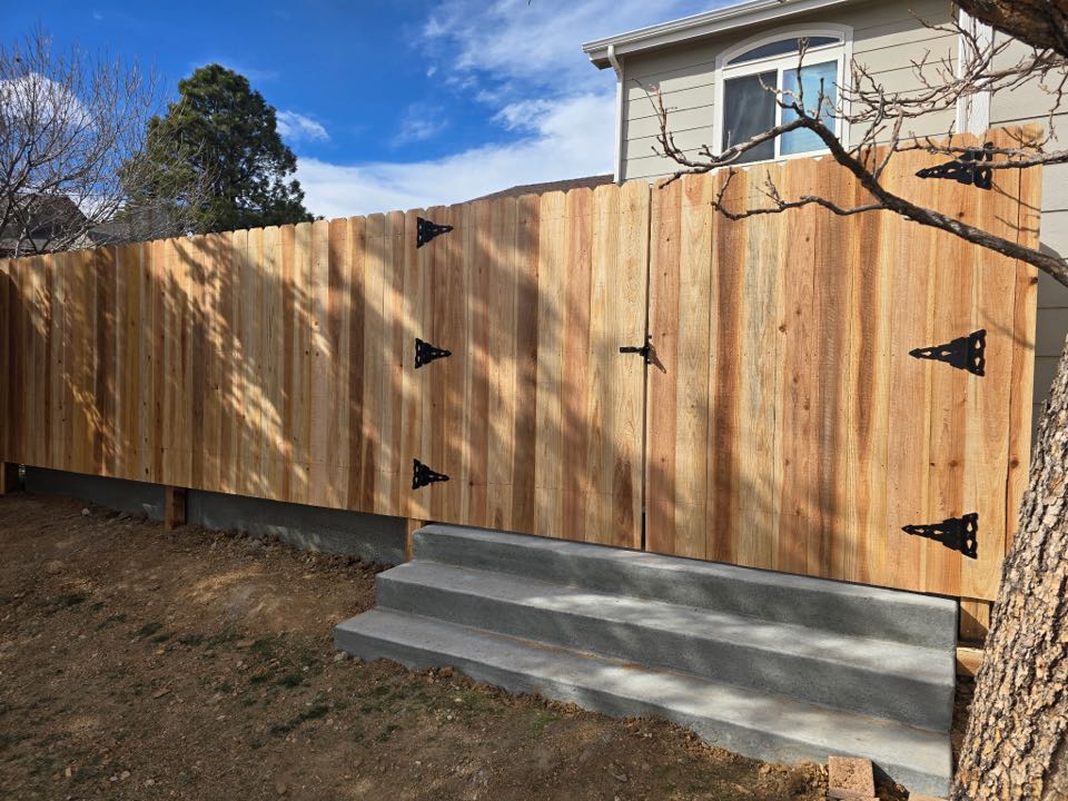 Top Rail Fence completed a beautiful 6 foot high cedar privacy fence with a double gate in Thornton Colorado. 