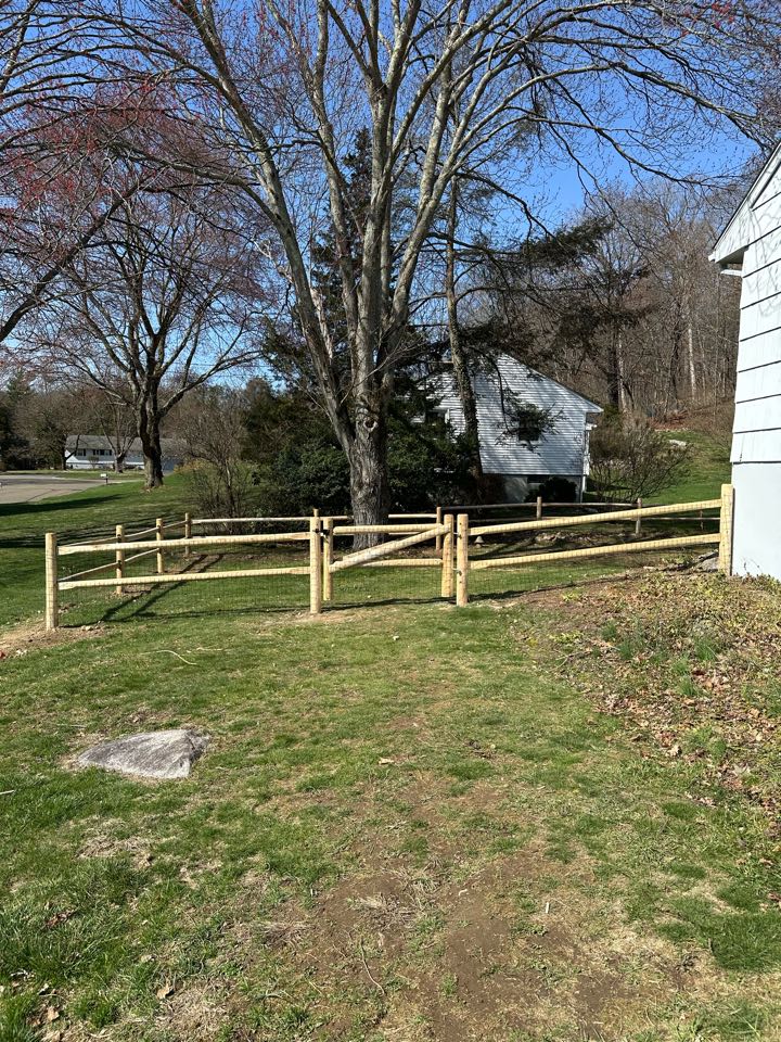 Just finished a beautiful and functional cedar post and rail fence with welded wire attached in Norwalk! Our customer’s dog is now safe and free to roam the back yard, and the property got some added curb appeal!