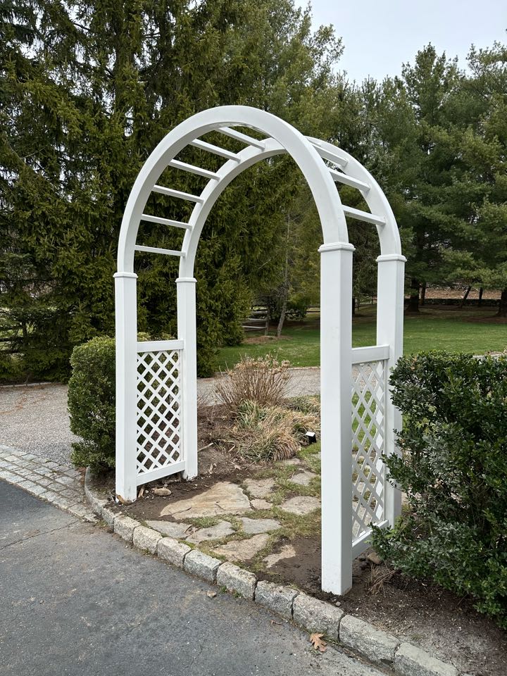 Just completed a beautiful new white vinyl arbor and cedar arbor top painted white in Darien!