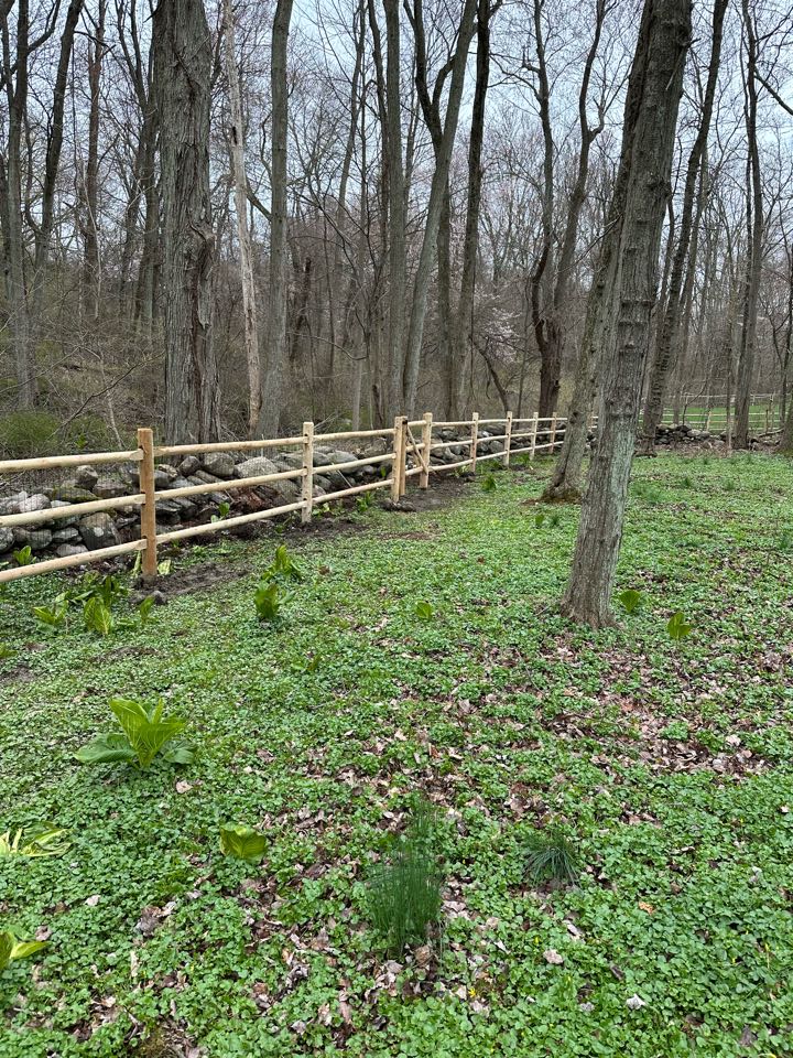 Finishing up a beautiful new 3-rail cedar post and rail fence in Darien! Coyotes kept outside and dogs safe inside!