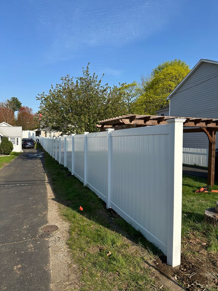 Just finished a project to replace an aging cedar privacy fence with a beautiful new white vinyl privacy fence for our customer in Darien!