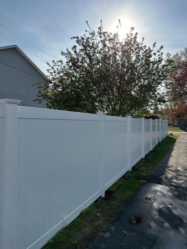 Just finished a project to replace an aging cedar privacy fence with a beautiful new white vinyl privacy fence for our customer in Darien!