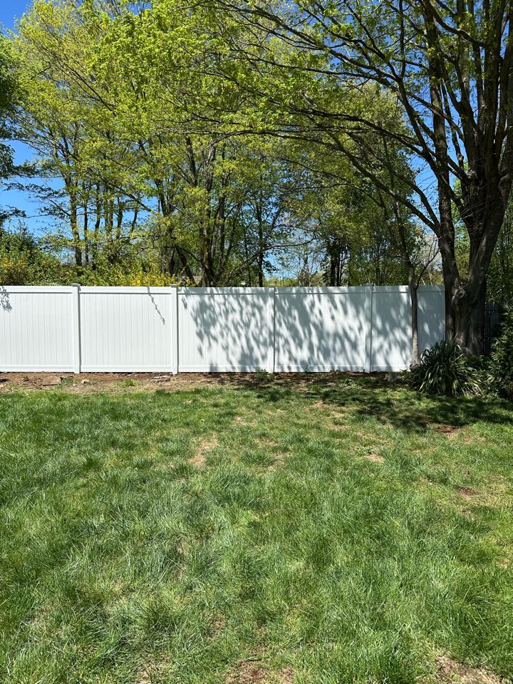 Just wrapped up a beautiful new 7 ft tall white vinyl privacy fence - 7 feet for that extra little bit of privacy in Norwalk!