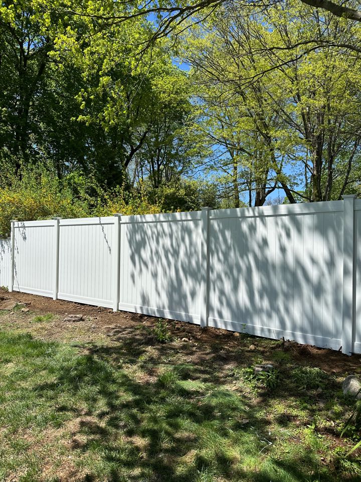 Just wrapped up a beautiful new 7 ft tall white vinyl privacy fence - 7 feet for that extra little bit of privacy in Norwalk!