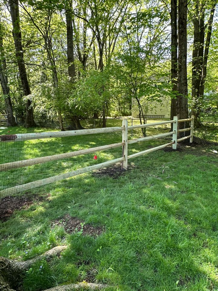 Finishing up a pressure treated split rail fence with welded wire attached to keep the dogs safe in Norwalk (Silvermine)!