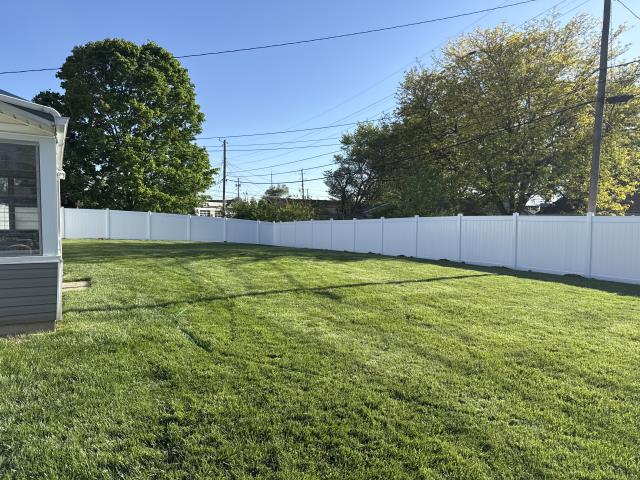 274 feet of 6’ high white vinyl privacy fence installed. 