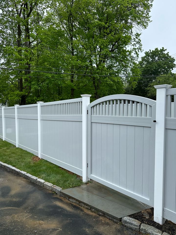 Just finished a beautiful new gray vinyl privacy fence, part with a classic capped picket top, Westport! Privacy and safety for a young family and pets!