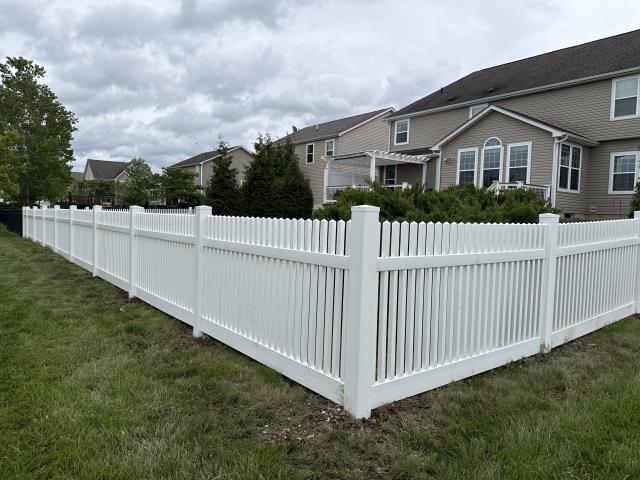 212 feet of 4’ high white vinyl picket fence installed. 