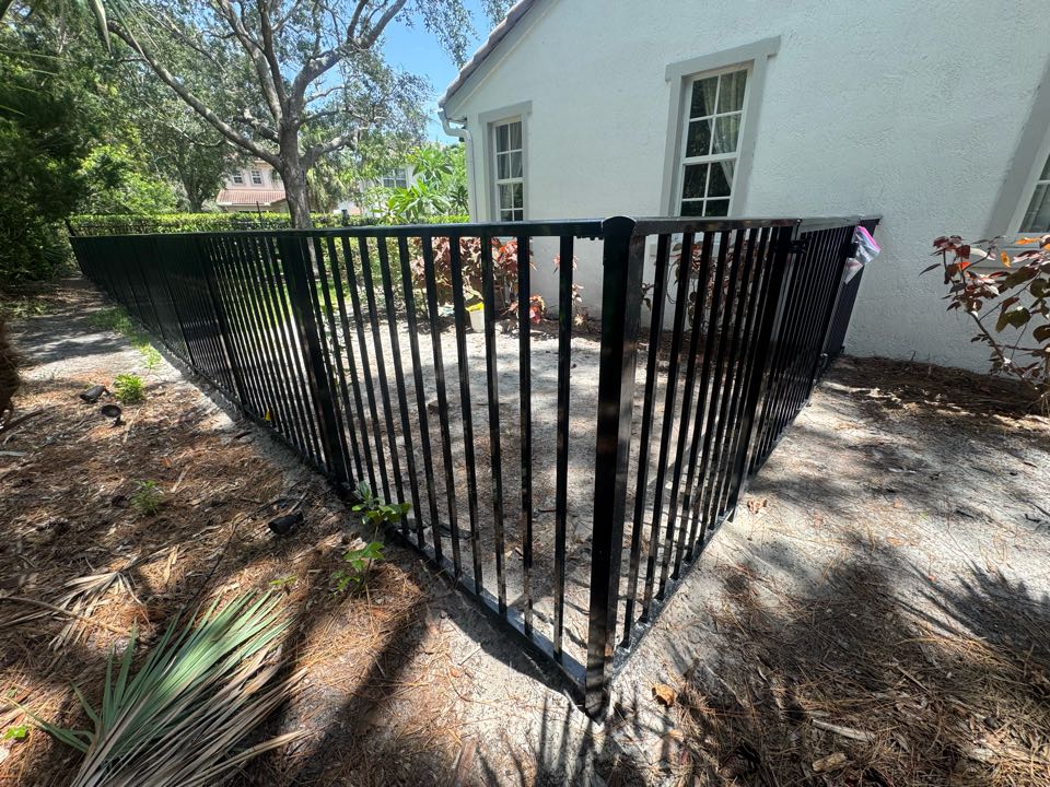In the Evergrene community of Palm Beach Gardens, FL, we installed 130 feet of 4-foot-tall black aluminum fencing for a young couple looking to create a safe space for their two small dogs. The new fence blends seamlessly with the neighborhood while providing security and peace of mind.