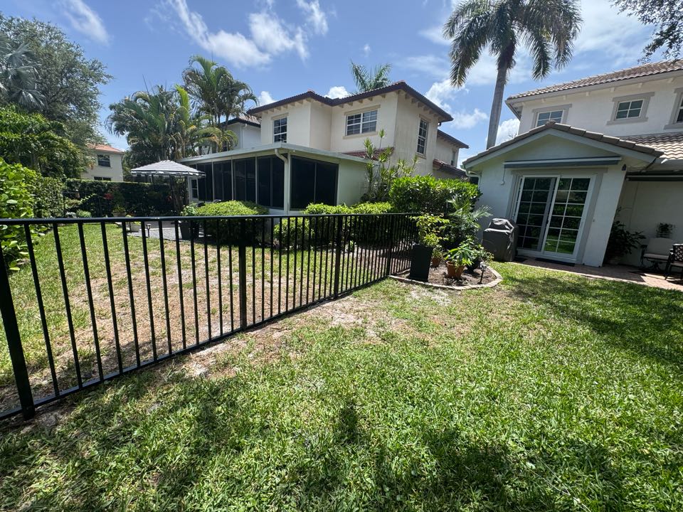 In the Evergrene community of Palm Beach Gardens, FL, we installed 130 feet of 4-foot-tall black aluminum fencing for a young couple looking to create a safe space for their two small dogs. The new fence blends seamlessly with the neighborhood while providing security and peace of mind.