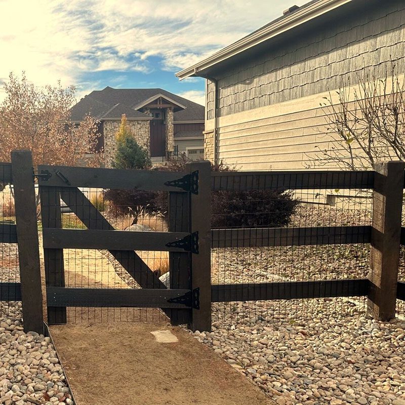 post and rail fence with gate and wire in fort collins
