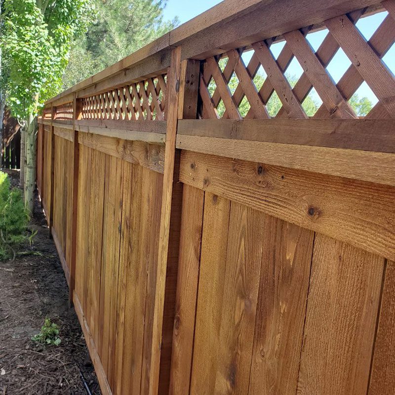 Stockade wood fence with lattice trim in denver