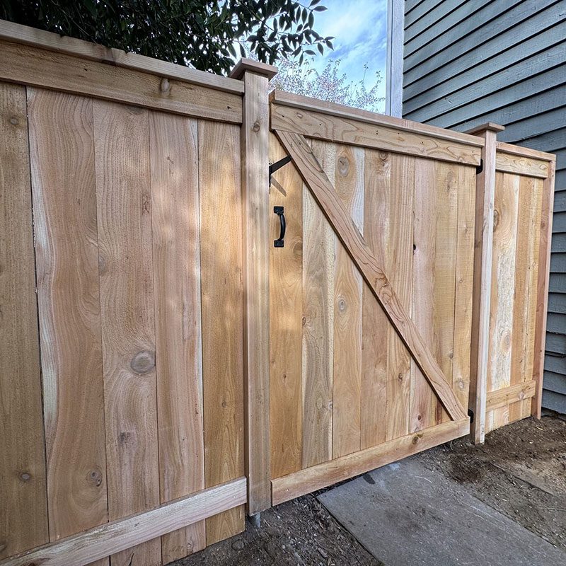 stockade fence with cap and trim