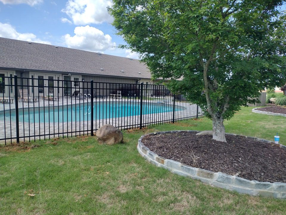 aluminum fence surrounding pool