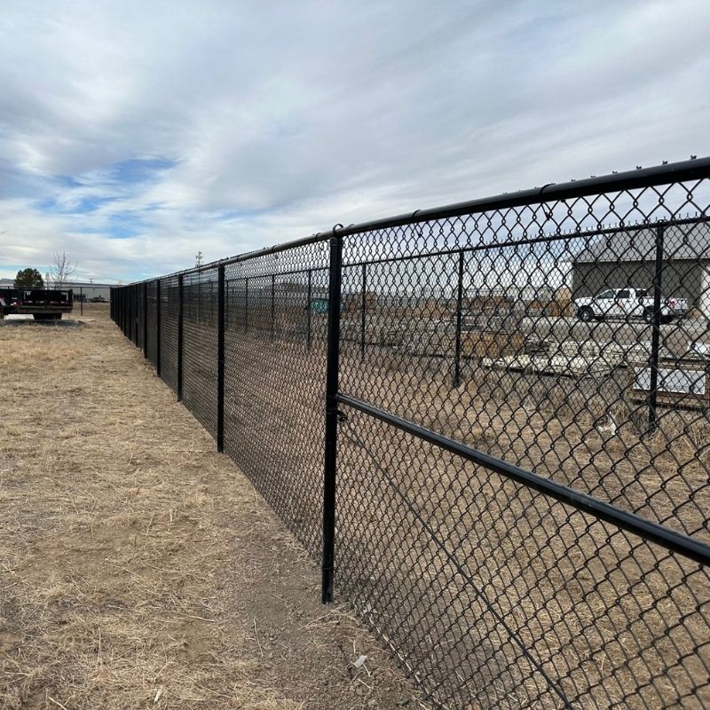 black chain link commercial fence installed by Top Rail Fence