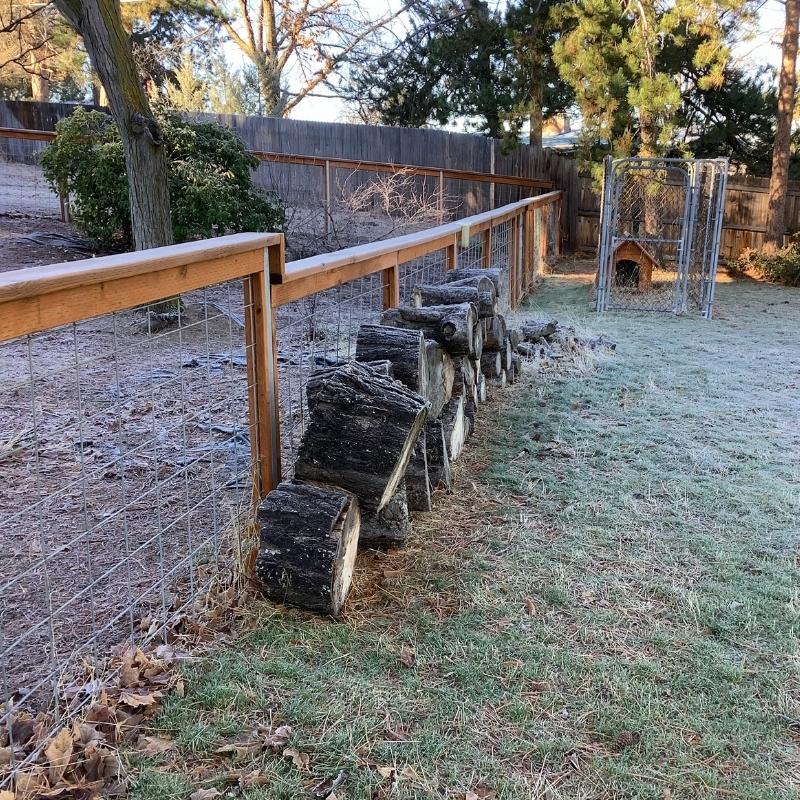 Cedar hog wire fence installed by Top Rail Fence