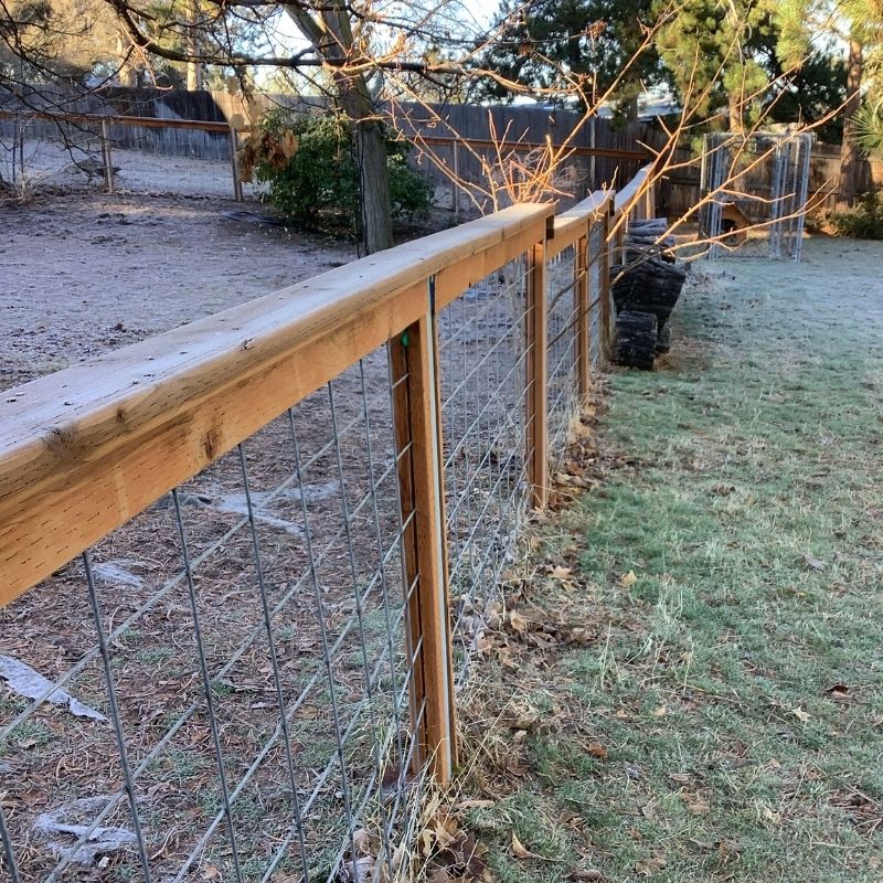 Cedar hog wire fence installed by Top Rail Fence