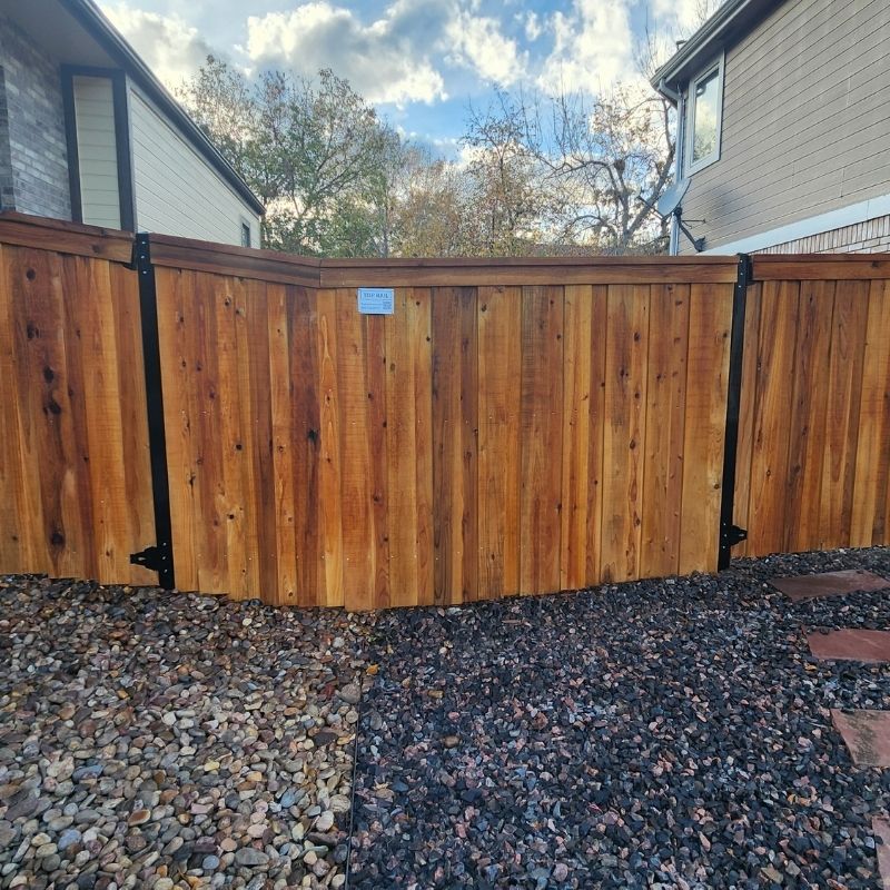 cedar fence installed by top rail fence