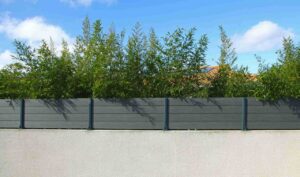 Vinyl fencing on a brick wall