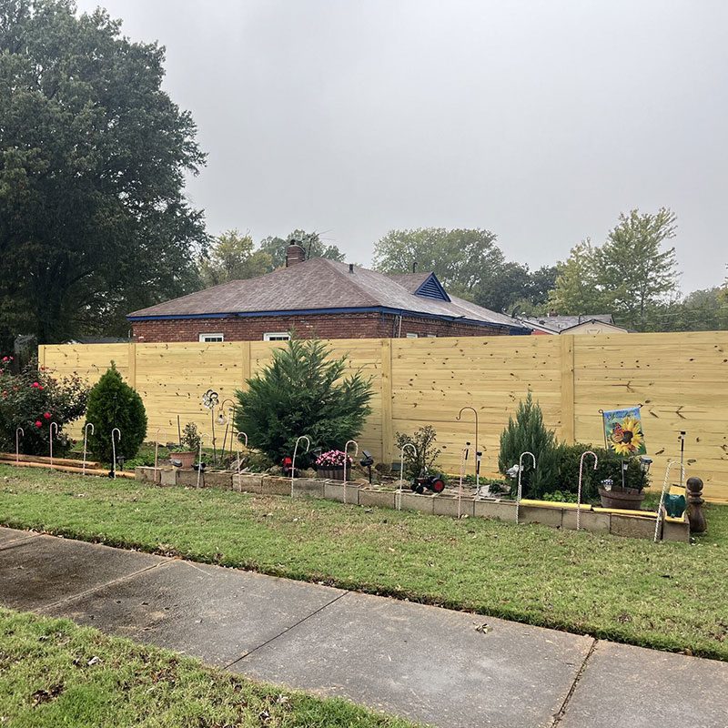 Wood privacy fence installed by Top Rail Fence