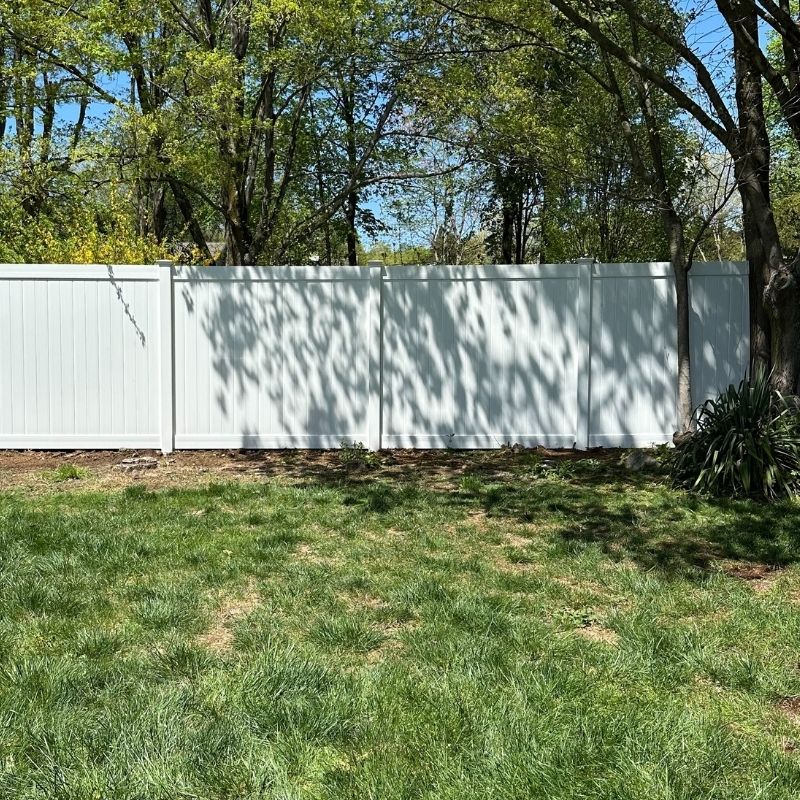 White vinyl privacy fence installed by Top Rail Fence