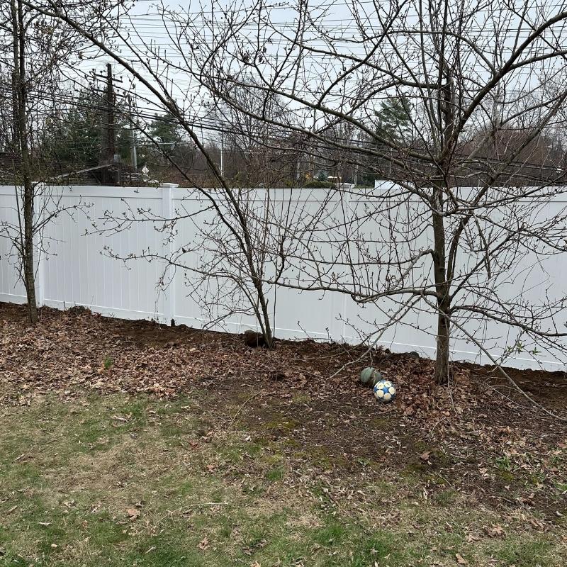 new white vinyl fence installed by Top Rail Fence