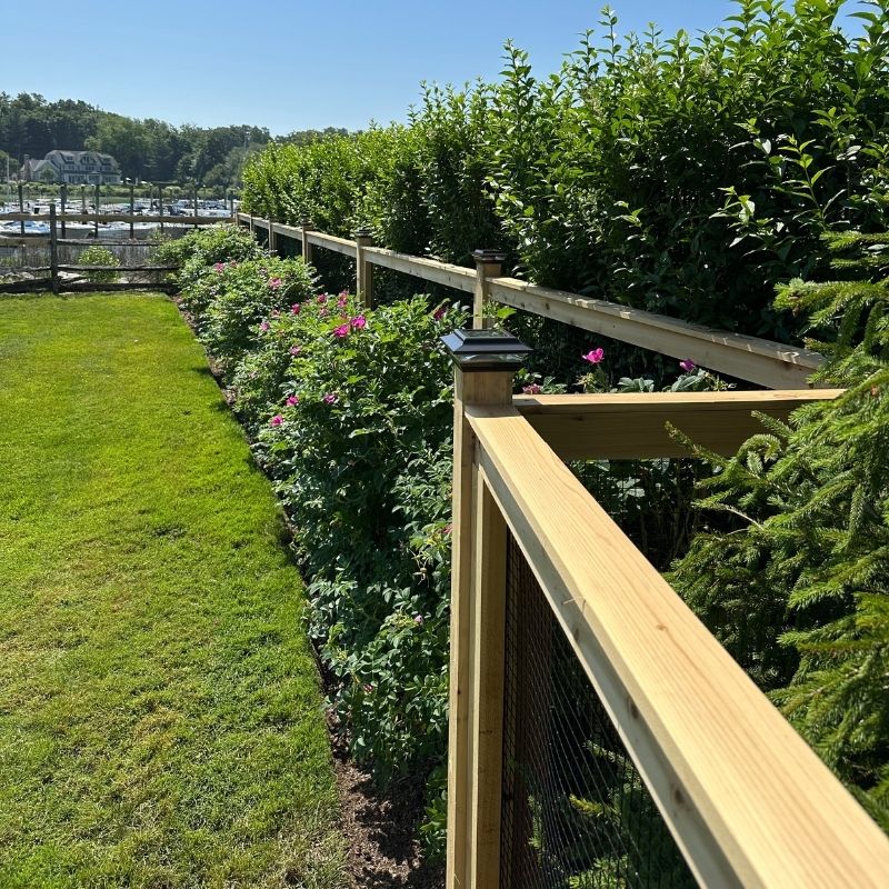 cedar fence installed by top rail fence