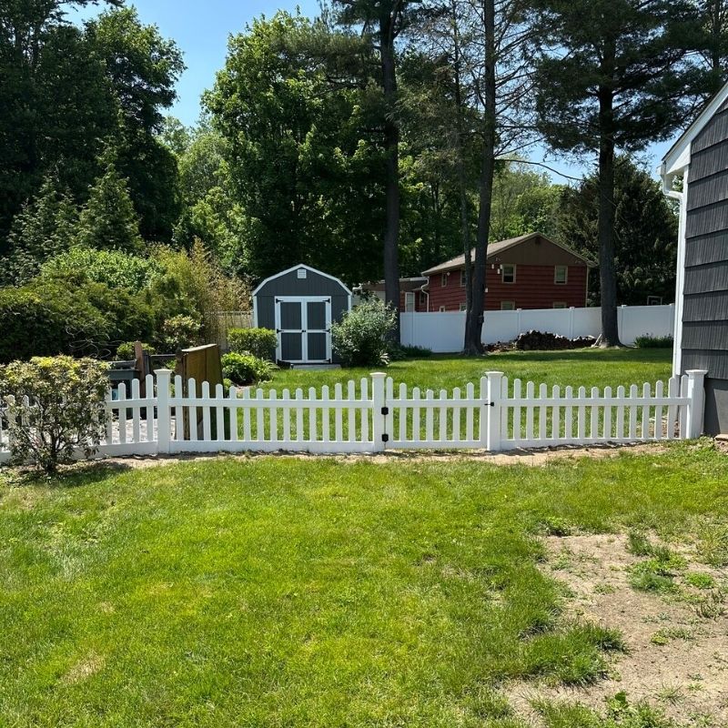 white vinyl fence installed by Top Rail Fence