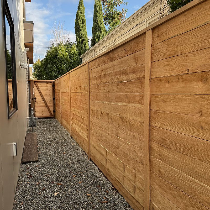 side of house wood horizontal wood fence