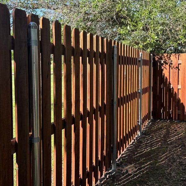 inside look at a wooden Top Rail Fence in North Texas