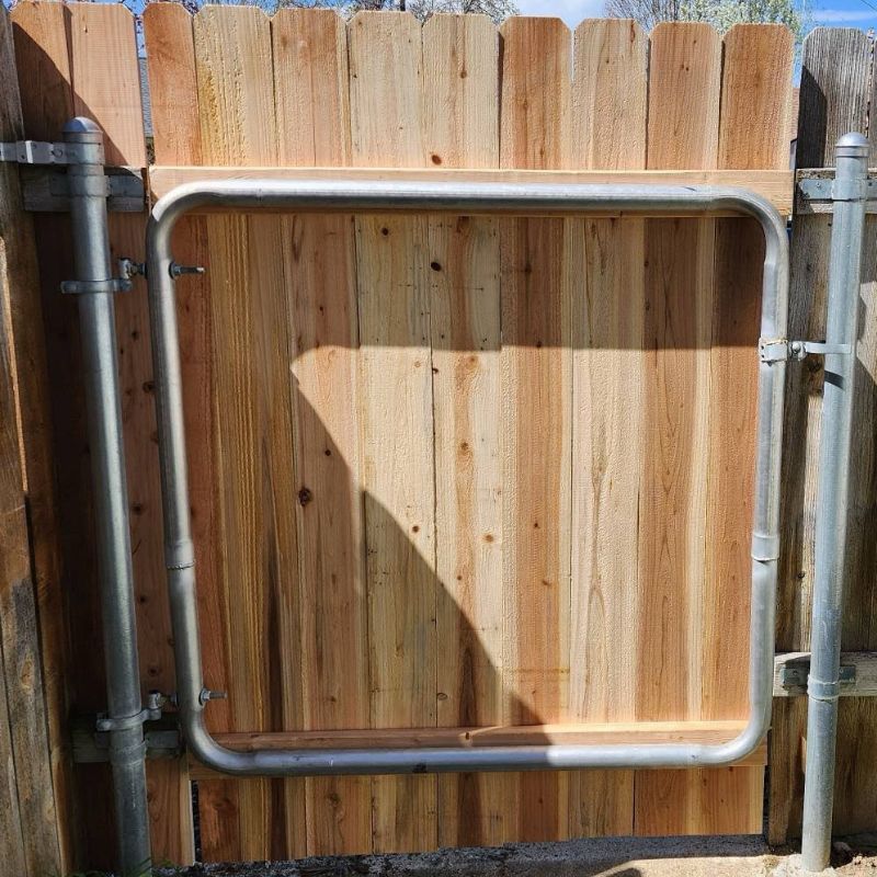 New wood gate installed on fence