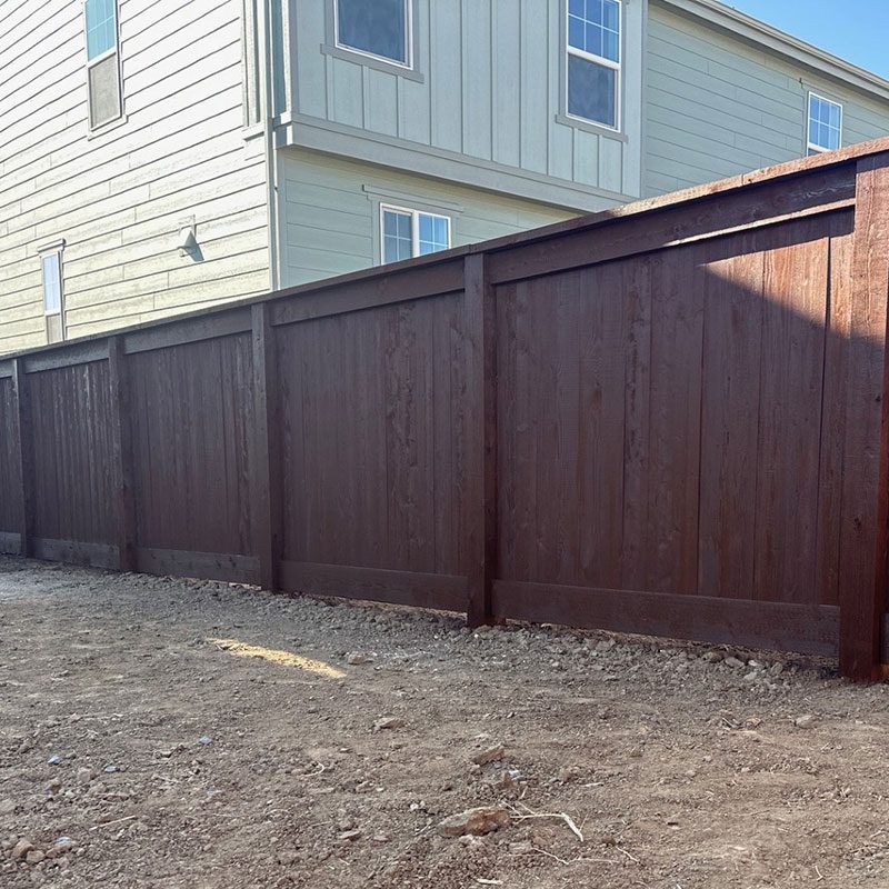 wide view of cap and trim woof fence privacy