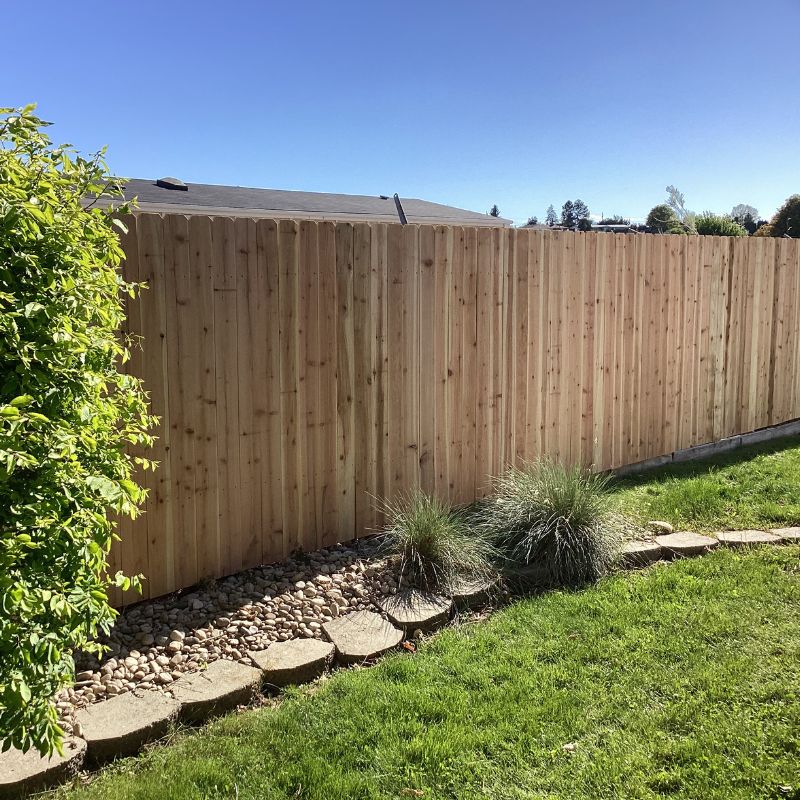 A new cedar wood fence with landscaping