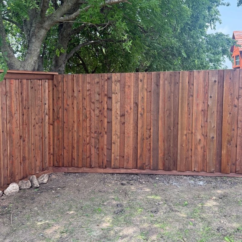 6-foot board-on-board fence with cap and trim installed by Top Rail Fence